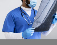 side-view-nurse-looking-radiography