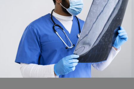 side-view-nurse-looking-radiography