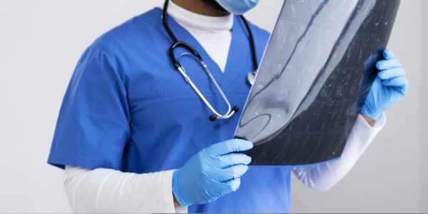 side-view-nurse-looking-radiography