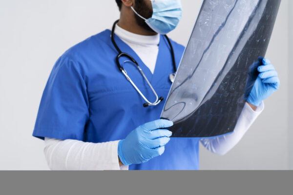 side-view-nurse-looking-radiography